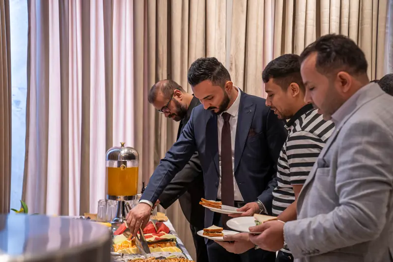 Guests serving themselves at the refreshment buffet
